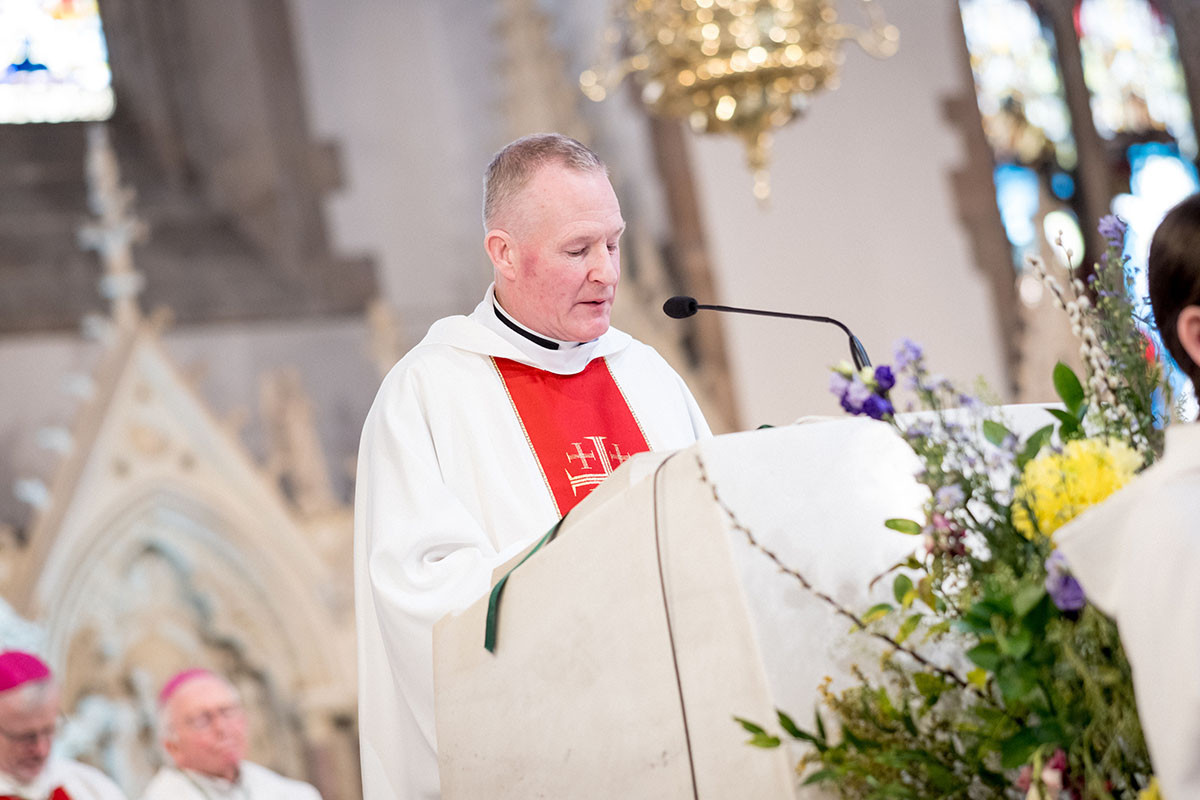 Fr Sean O‘Donnell proclaiming the Gospel during the Silver Jubilee Mass in St Eugene’s Cathedral, Derry